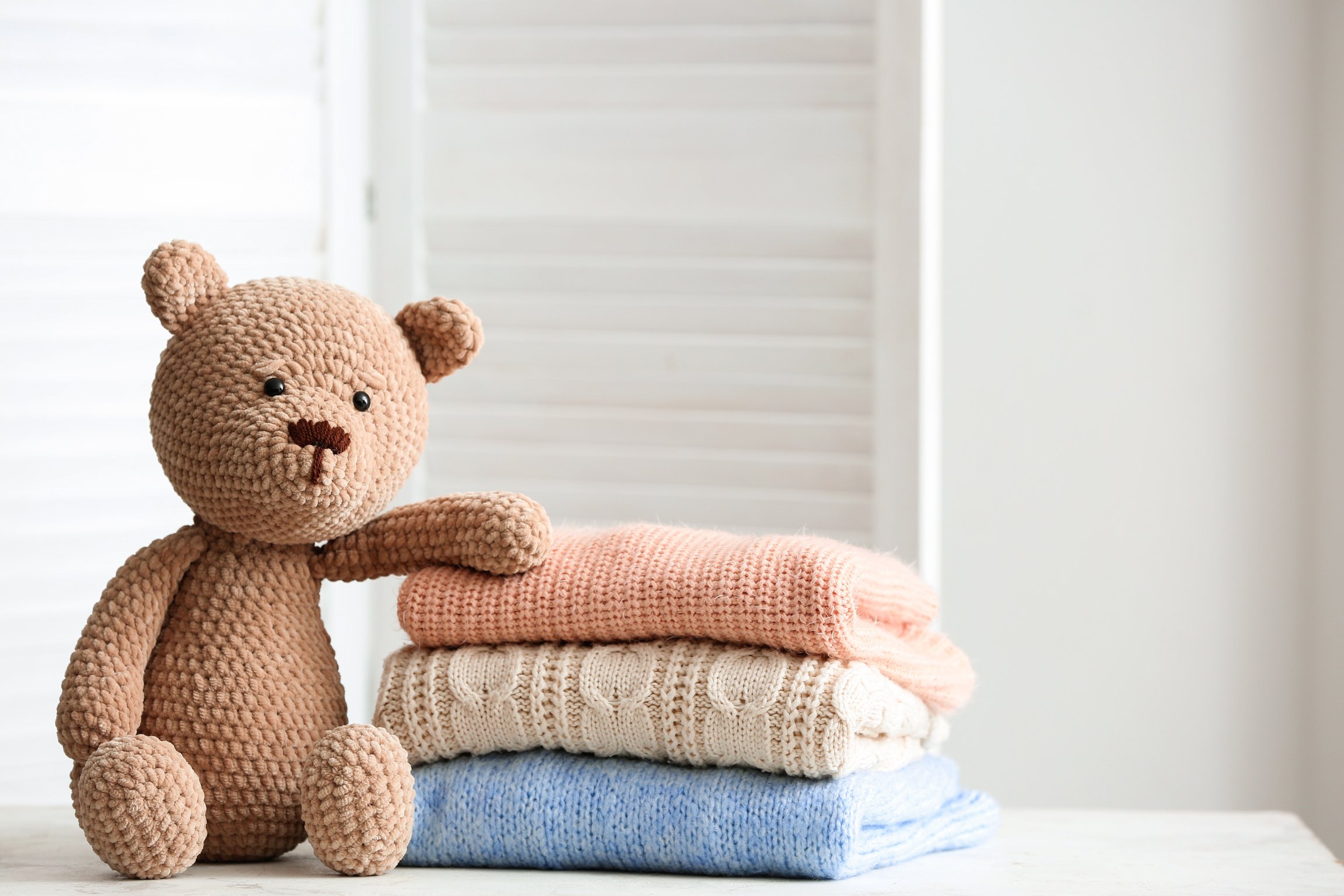 Stack of Clean Kid's Clothes with Toy 